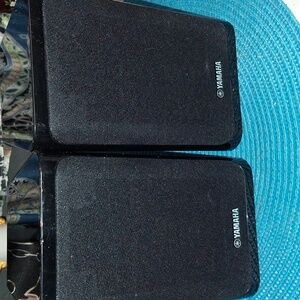 The Yamaha NS-B40 speakers are compact, rectangular, wired surround/satellite